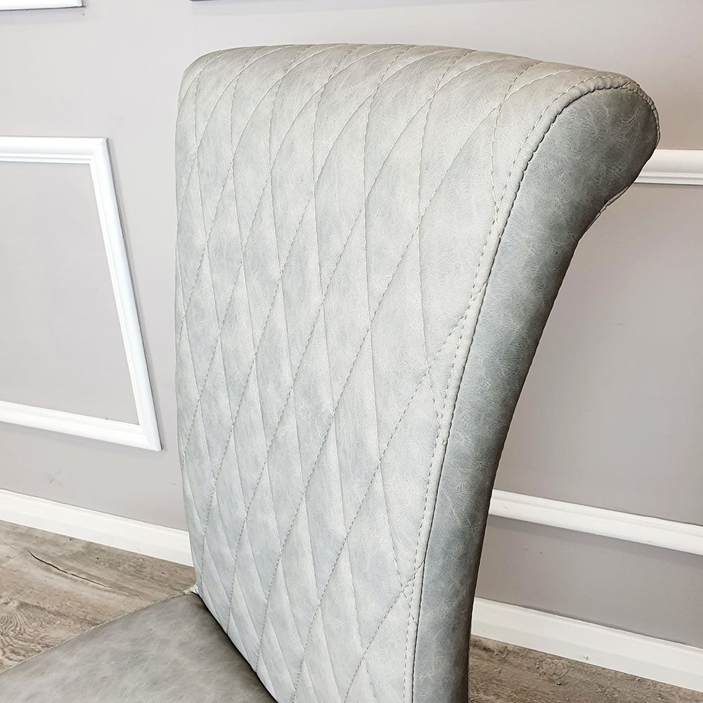 Nicole Dining Chair in Light Grey Leather with a cross stitch detail